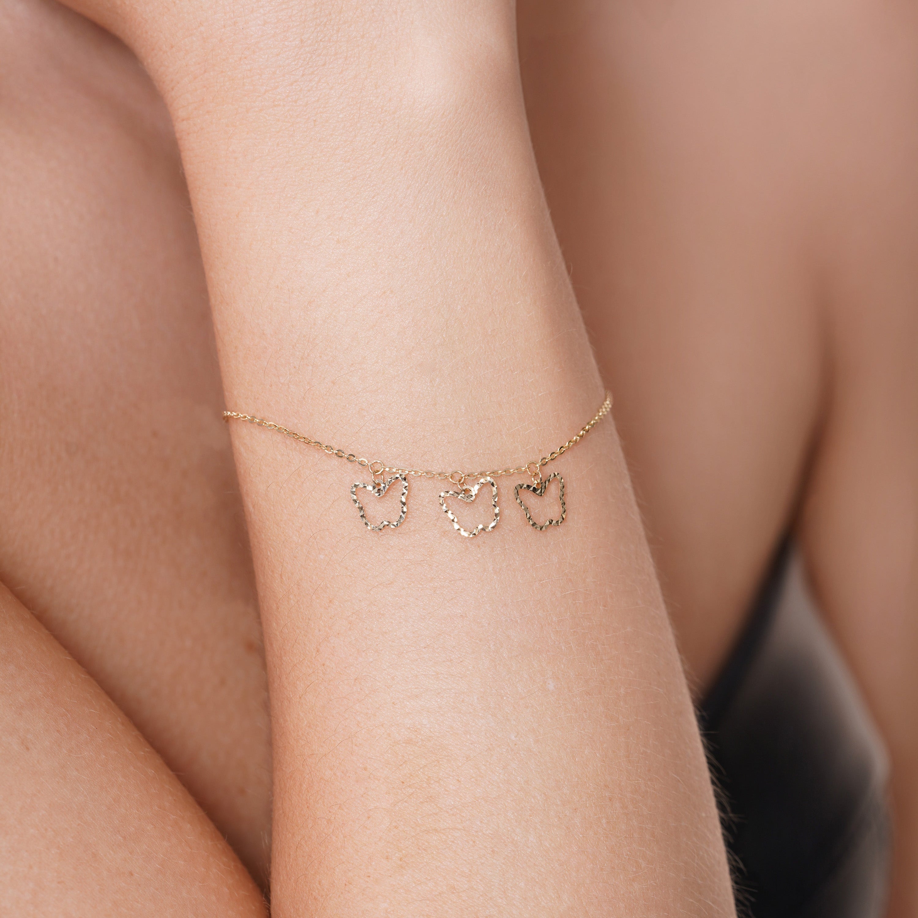 14KB0017. - 14 Karat Yellow Gold Three Diamond Cut Butterfly Adjustable Bracelet