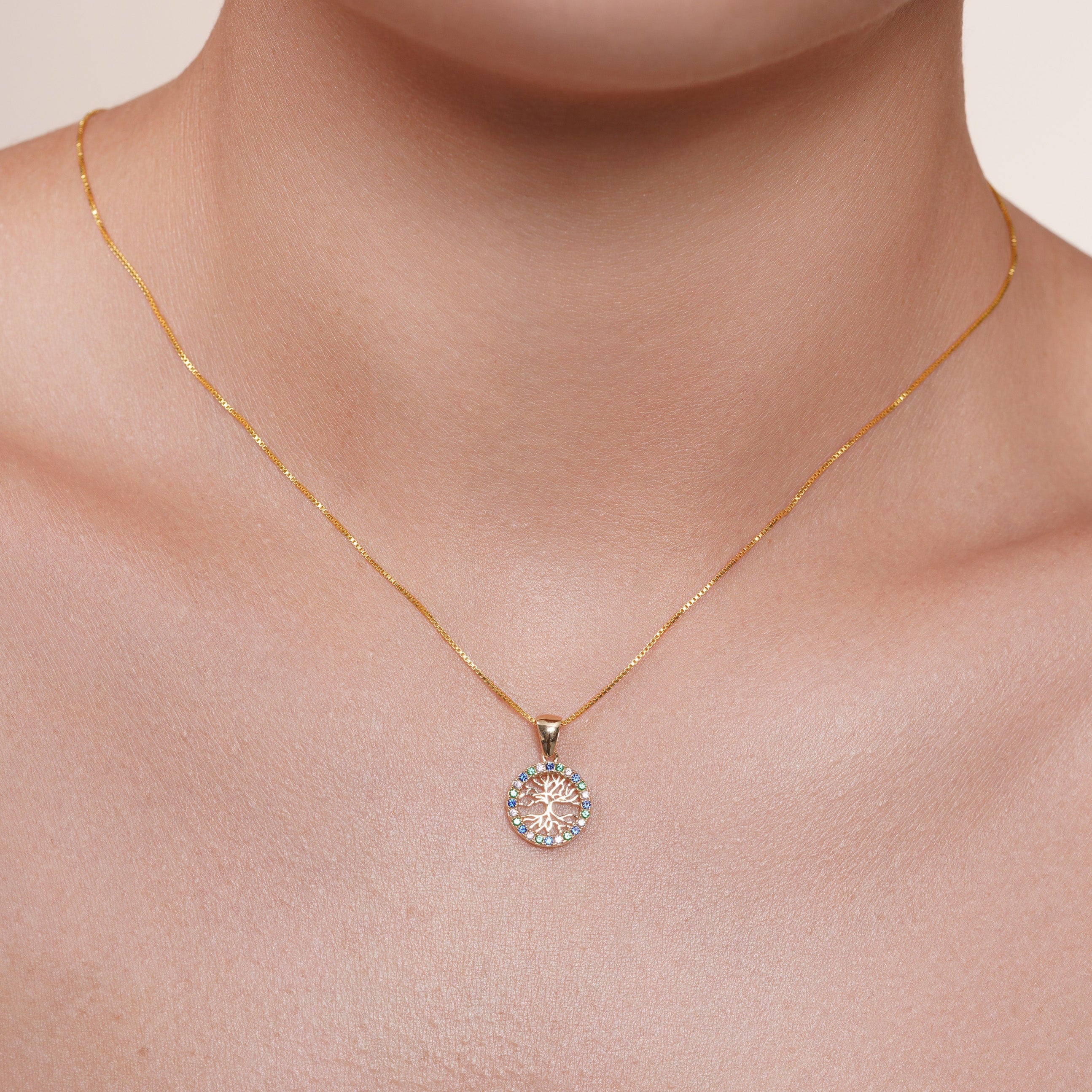 14KP0004. - 14 Karat Yellow Gold 11.5mm Reversible Tree of Life Clear or Clear Blue and Green CZ Studded Pendant