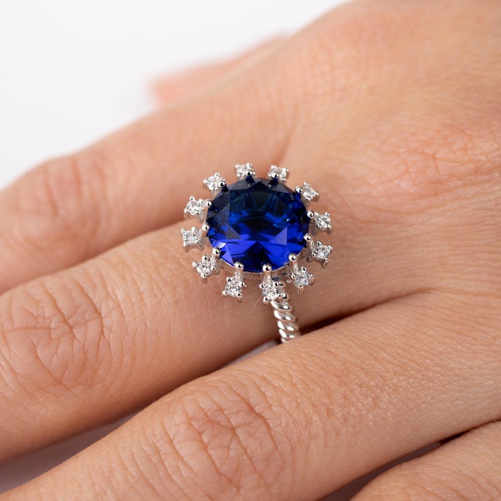 Rhodium Plated 925 Sterling Silver Blue Center Flower CZ Ring with Rope Band - BGR01302BLU