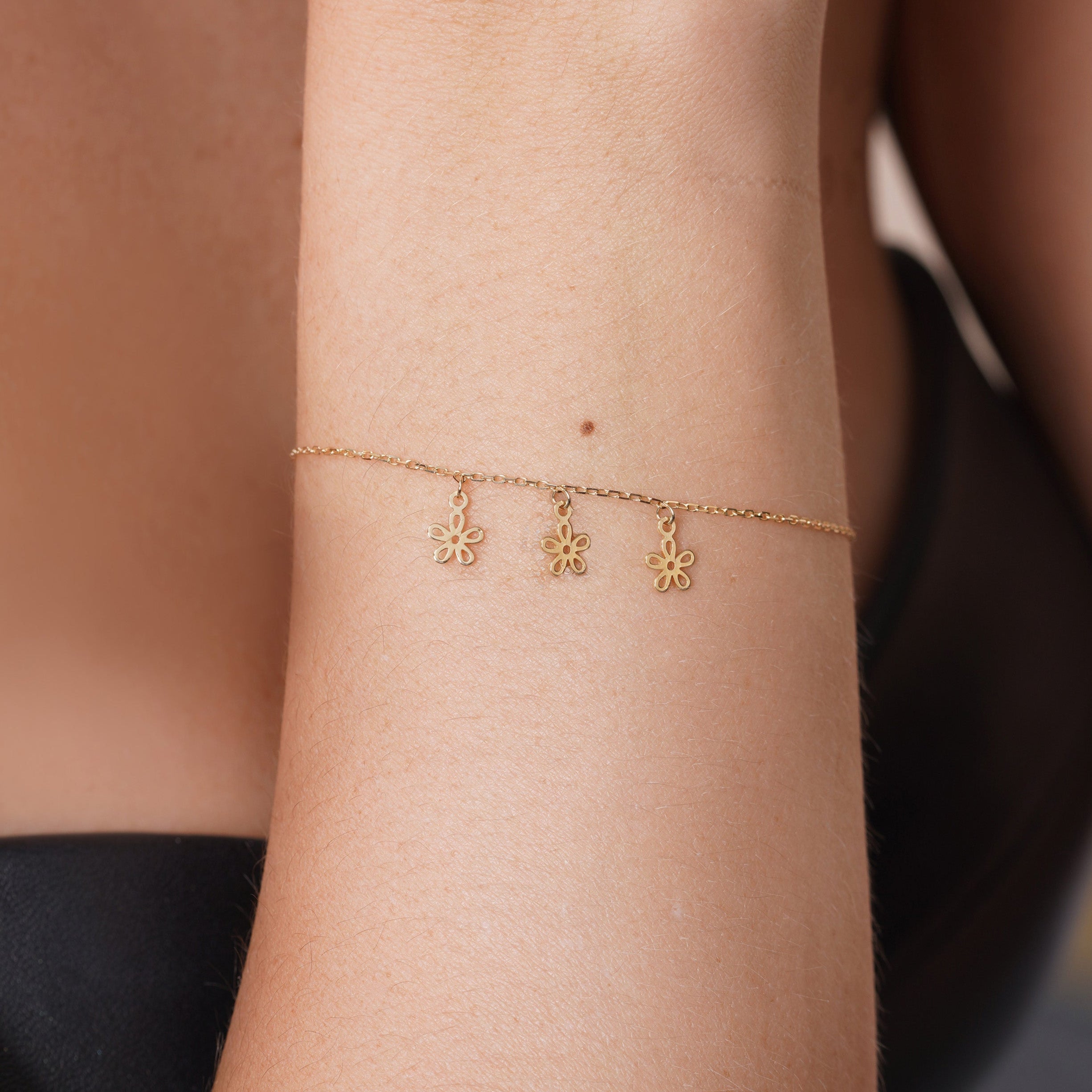 14KB0015. - 14 Karat Yellow Gold Three Flowers Charm Adjustable Bracelet