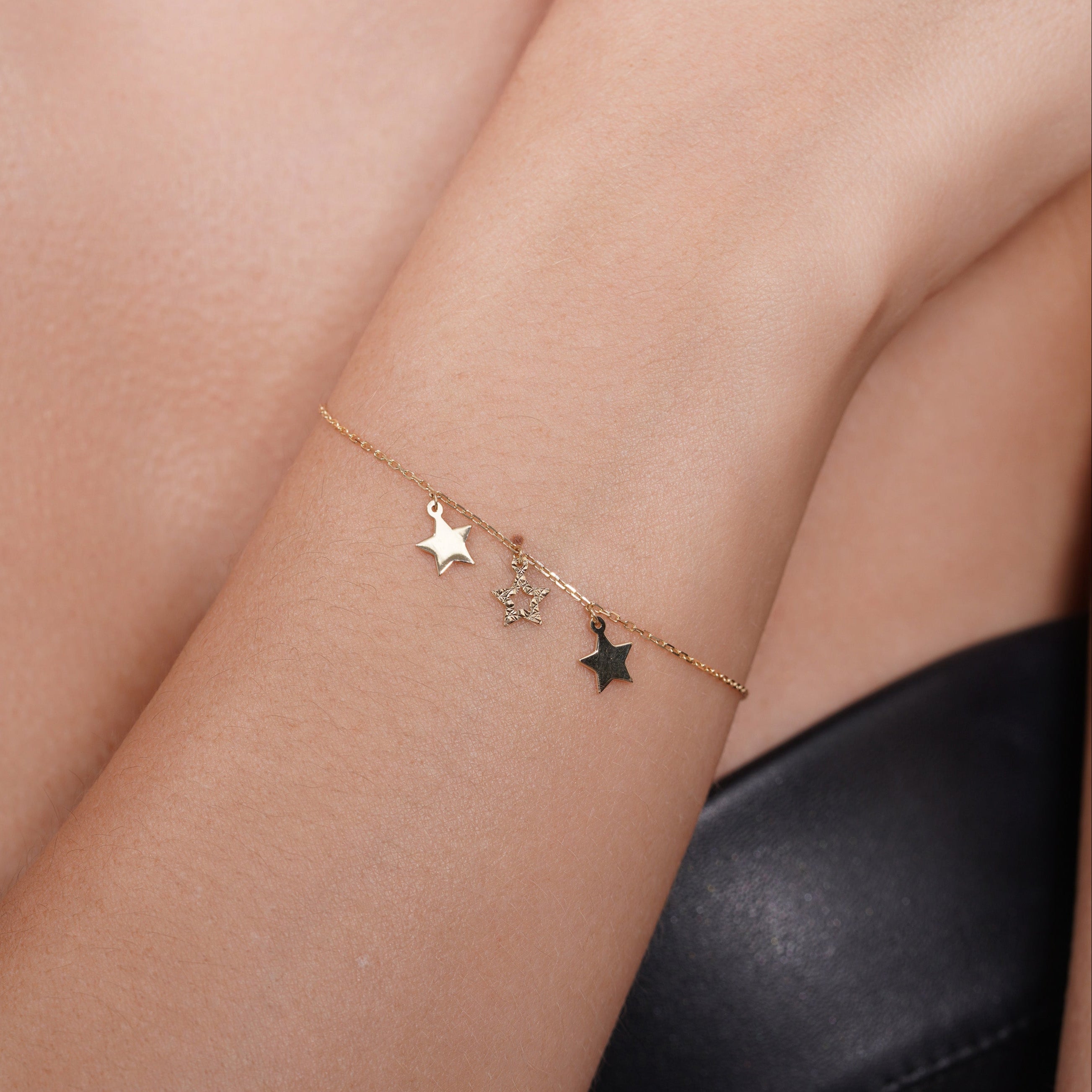 14KB0019. - 14 Karat Yellow Gold Three Stars Diamond Cut Charm Adjustable Bracelet