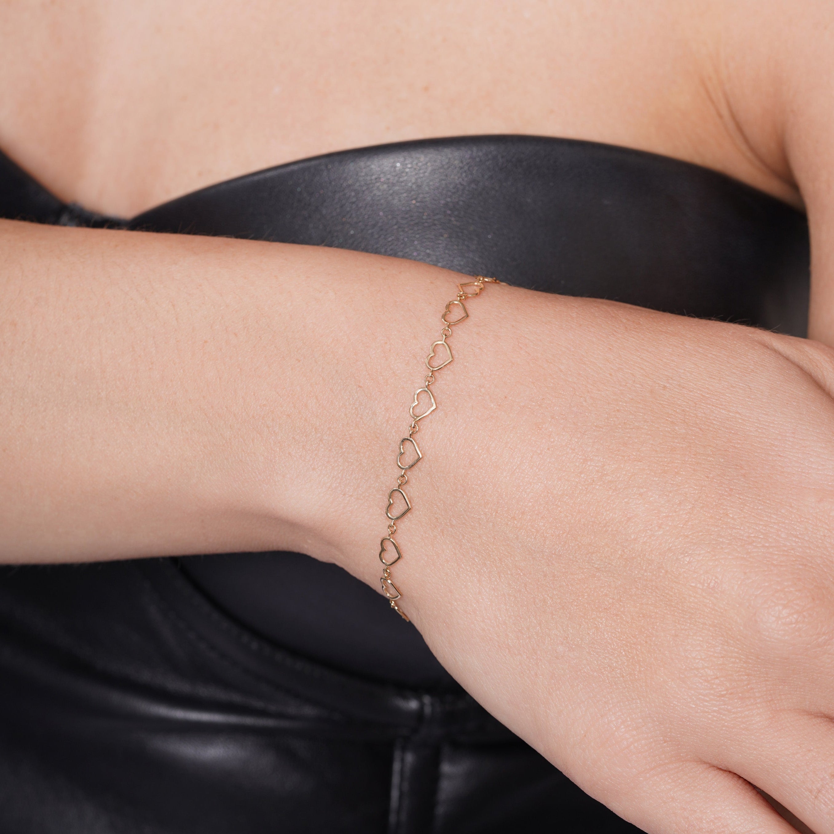 14KB0008. - 14 Karat Yellow Gold Multi Heart Charms Adjustable Bracelet