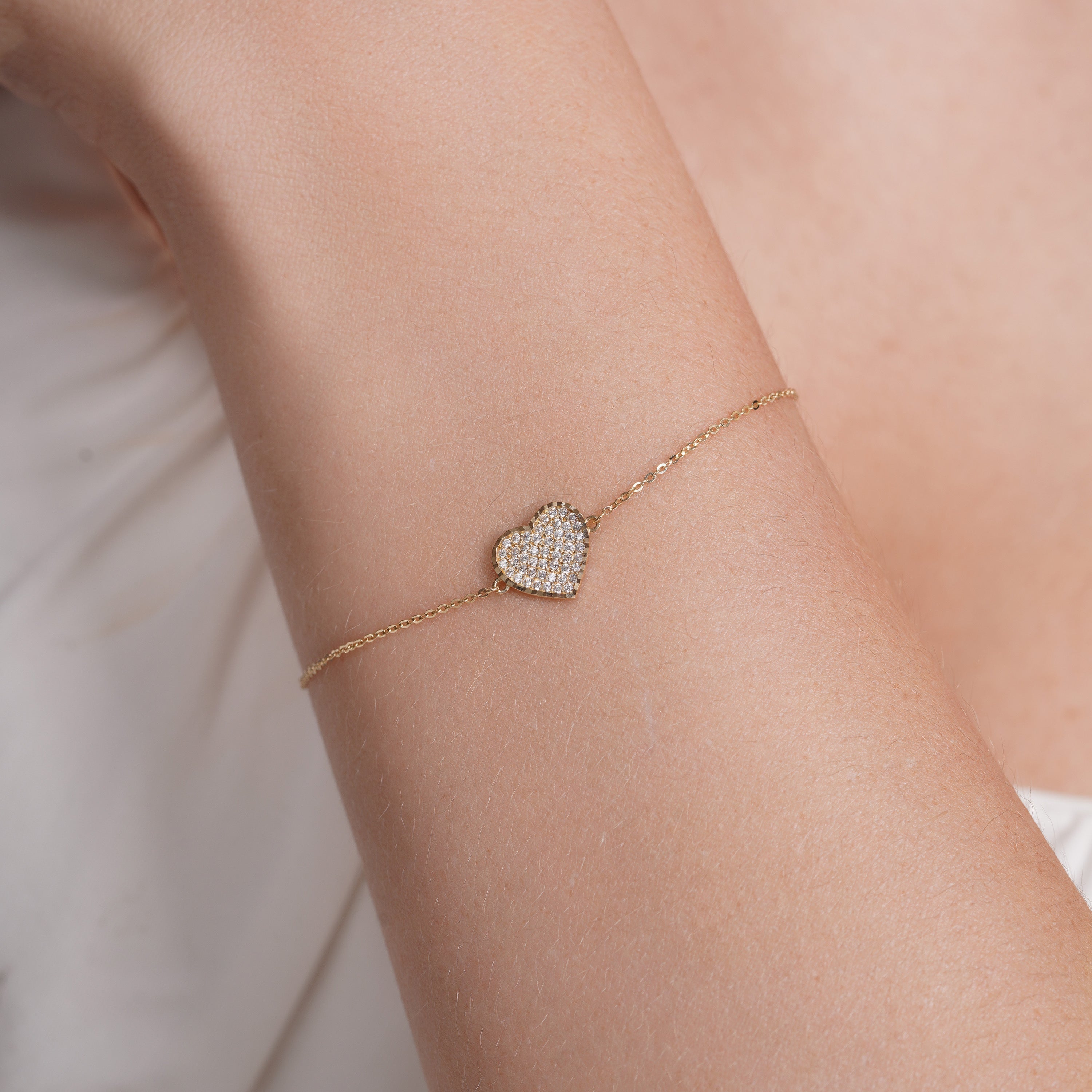 14KB0011. - 14 Karat Yellow Gold Diamond Cut Heart Studded CZ Charm Adjustable Bracelet