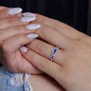 Rhodium Plated 925 Sterling Silver Knotted Blue CZ Ring - BGR01112BLU